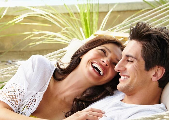 Young couple celebrating their new pool and patio project completion